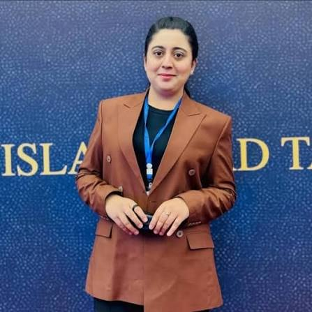 Kiran Khan in a tailored brown blazer at a professional media event